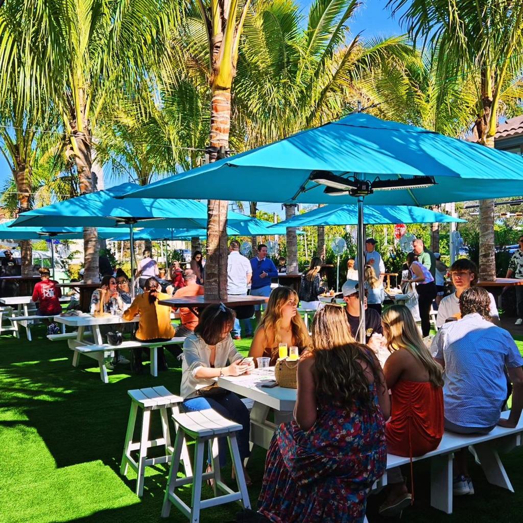 group of customers enjoying the outdoor turf area