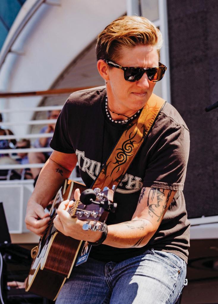 Musician Kelly Neff playing guitar